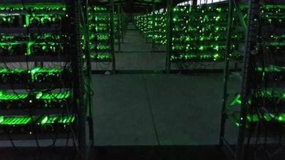 Mining farm with rows of hosted Bitcoin mining rigs efficiently organized
